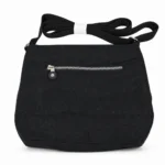 Polyester organizer crossbody OEM SKU 3042 with black textured fabric body, front zipper pocket, curved lower panel, and strap points