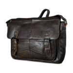 Dark cowhide satchel with broad flap, twin buckle-style tabs and top handle — Cowhide leather, SKU 3573