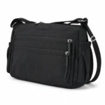 Polyester utility crossbody bag OEM SKU 5032 with black fabric body, front zipper sections, side pockets, and strap points