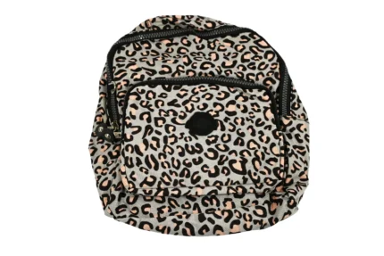 Angle view of animal-print polyester backpack SKU 6442 showing side depth, front pocket layout, and top handle