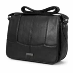 Curved-panel sheepskin shoulder bag OEM SKU 6691 with black rounded body, vertical seams, lower curved panel, and strap