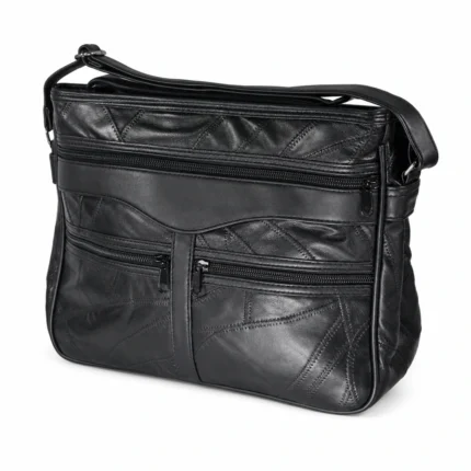 Black patchwork multi-pocket tote OEM SKU 6774 with curved front panel, front zipper pockets, rear zipper pocket, and shoulder strap