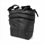 Vertical PU shoulder bag OEM SKU 6785 with curved front panels, central seam, lower patch panels, rivet details, and shoulder strap