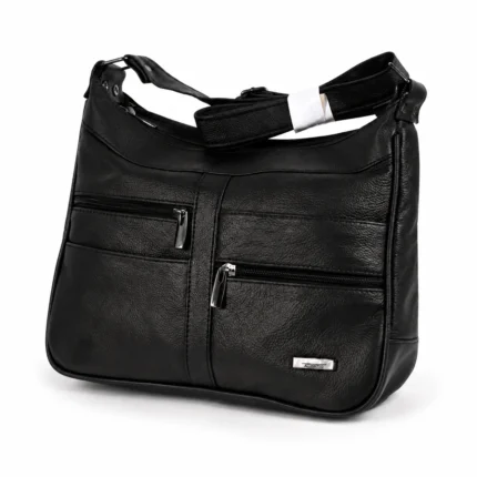 Asymmetric-zip cowhide shoulder bag OEM SKU 706FB with black leather body, front zipper pockets, curved top line, and strap