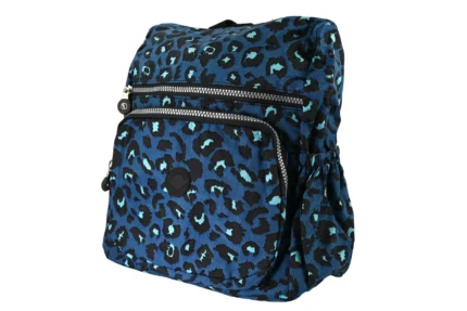 Angle view of blue animal-print polyester backpack SKU 7442 showing side depth, front zippers, and shoulder strap construction