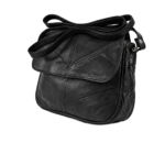 Angled front view of the black flap bag with piped lower edge and side ring — Sheepskin leather, SKU L124